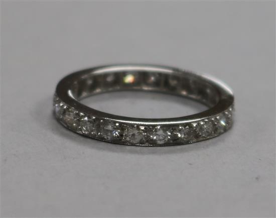 A white metal and diamond set full eternity ring, size M.